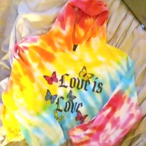 A rainbow long-sleeved "love is love" crop top
